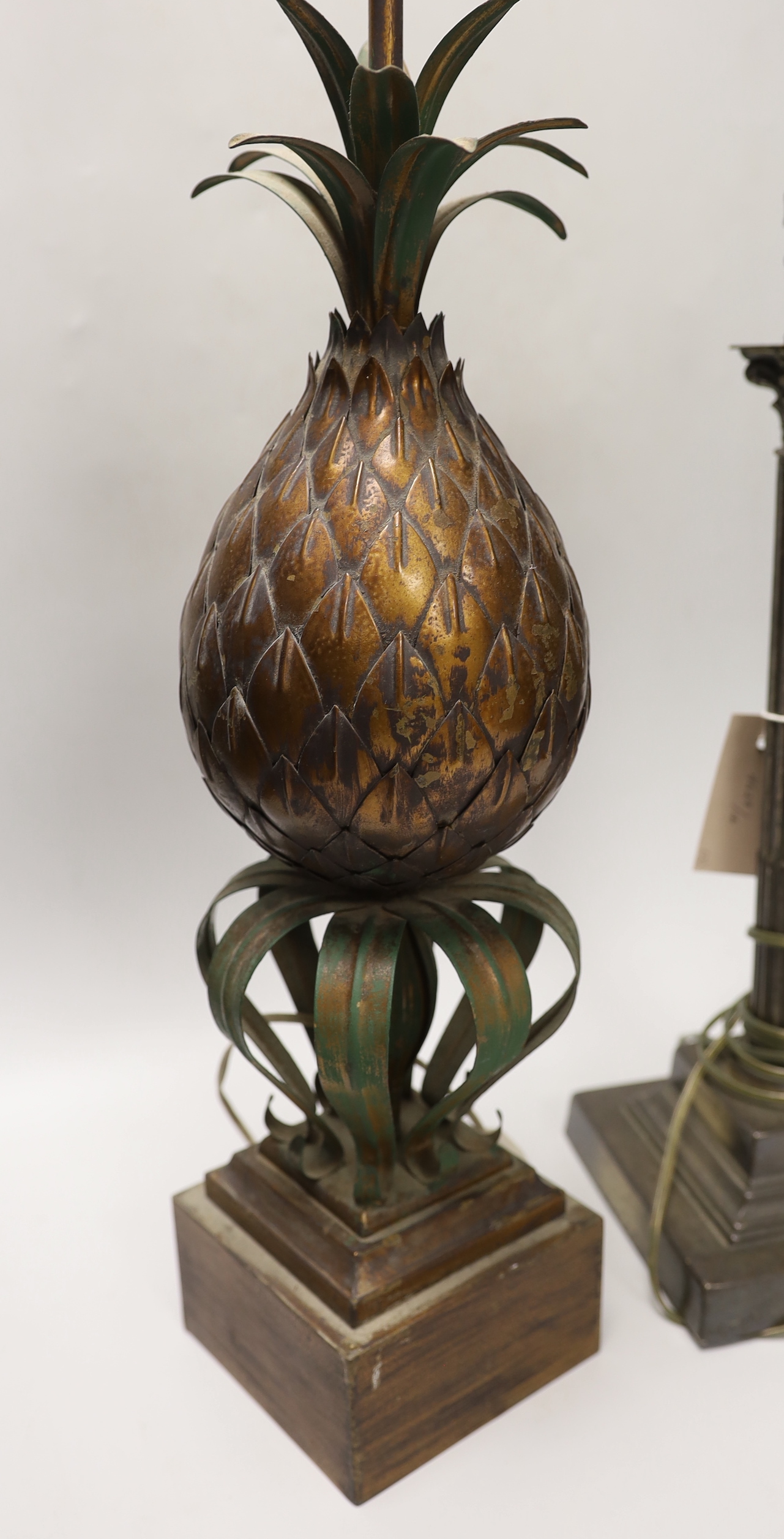 A novelty pineapple table lamp and a plated Corinthian lamp